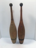 A pair of antique solid wood exercise juggling pins