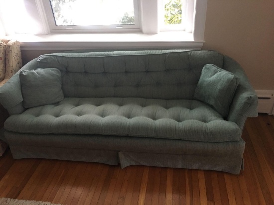 Green tufted couch sofa