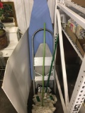 Ironing board, steam iron, stepstool, dust mops, more
