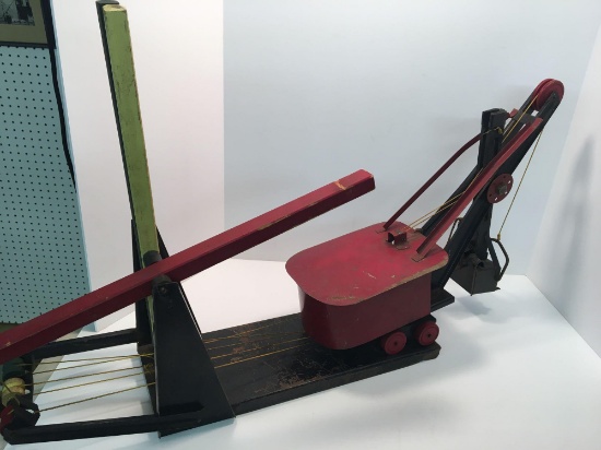 Vintage pressed metal toy steam shovel(mounted;operational with wooden handles)