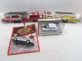 2 die cast Police cars,2- plastic fire trucks
