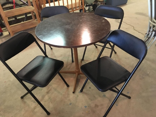 4 folding chairs,small round table