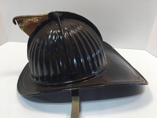 Antique metal CAIRNS fire helmet