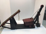 Vintage pressed metal toy steam shovel(mounted;operational with wooden handles)