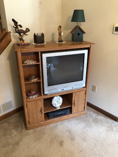 Wood like entertainment center,SYLVANIA 27 inch TV,SANYO VHS player, knickknacks(bring own box)