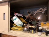 Contents of cabinet (extension cords, extension cord ends, pan light, more)