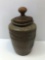 Stoneware/pottery crock and a carved wood butter stamp