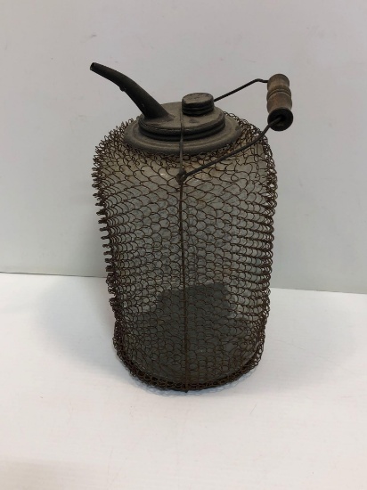 Vintage glass oil/kerosene fill jug with wire mesh frame