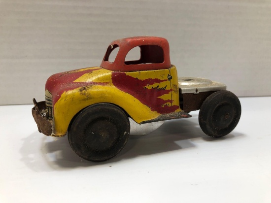 Yellow and red tin toy