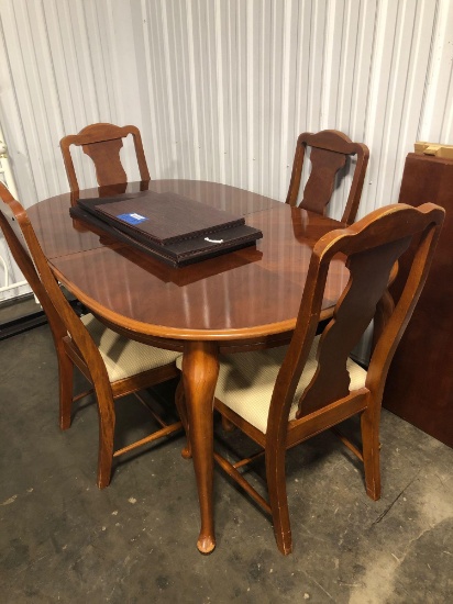 Queen Anne style dining room table, 4 chairs, table cover pads, one leaf that needs repair