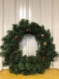 Artificial Christmas wreath lighted with pinecones 30 inches in