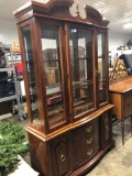Two piece early American style glass door hutch and base, one glass shelf is broken must replace