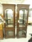 PAIR OF LIGHTED CURIO CABINETS APPROX 75 INCH TALL BY 24 INCH