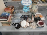 TABLE LOT OF DECORATIVES BOOKS BOTTLES PICTURE FRAMES SEA LIFE