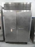 TRAUSLEN SS DBL REACH IN FREEZER MOD G22010 ON CASTERS