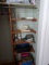 CONTENTS OF CLOSET TO INCLUDE SEWING BASKETS PICTURE FRAMES DECANTER AND MO