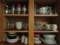 TWO CABINETS FULL OF EVERY DAY CHINA AND TUMBLERS AND BLUE WILLOW COFFEE CU