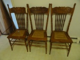 THREE OAK PRESSED BACK CHAIRS WITH BASKET WEAVE SEATS IN GOOD CONDITION