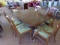 CHIPPENDALE STYLE DINING TABLE WITH 6 MATCHING CHAIRS WITH NEEDLE POINT SEA