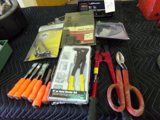 TABLE LOT INCLUDING CHISELS HAND RIVITOR BOLT CUTTER TIN SNIPS PICKLE FORK