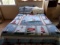 FULL SIZE BED WITH WICKER AND CARVED HEADBOARD AND LIGHTHOUSE MOTIFF LINENS