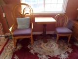 RATTAN ARM CHAIR AND SIDE CHAIR AND OAK TOP PEDESTAL TABLE