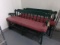 2 GREEN BENCHES WITH RED UPHOLSTERED CUSHIONS