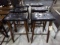 SIX WOODEN BAR STOOLS WITH BLACK VINYL SEATS APPROX 30 INCH TALL