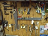 CONTENTS OF GARAGE WALL INCLUDING PIPE WRENCHES CLAMPS HAMMERS OPEN END WRE