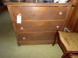 THREE DRAWER BUREAU WITH BRASS KEY HOLE GLASS PULLS AND CARVED DRAWERS