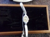 GRUEN LADIES WRIST WATCH MARKED 14K WITH 12 SMALL CLEAR STONES