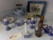 LARGE LOT OF BLUE AND WHITE ITEMS ON KITCHEN COUNTER ON BOTH SIDES OF SINK