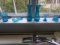 6 BLUE GLASS ON WINDOW SILL INCLUDING ENAMEL BASES