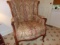 CARVED LET BARREL BACK ARMCHAIR