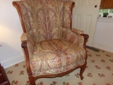 CARVED LET BARREL BACK ARMCHAIR