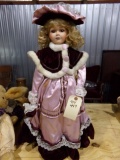 26 INCH DOLL WITH PORCELAIN HEAD AND FIXED EYES