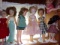 COLLECTION OF SIX DOLLS ON STANDS APPROXIMATELY 18