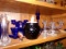 SHELF INCLUDING COLLECTION OF COBALT GLASS BLACK GLASS AMERICAN FOSTORIA CA