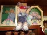 THREE CABBAGE PATCH DOLLS INCLUDING 1985 PREEMIE JOHN ROCKY AND DINO WOODY