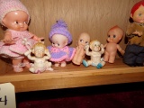 SHELF LOT INCLUDING TWELVE SMALL DOLLS MOSTLY KEWPIE TYPE APPROXIMATELY 2