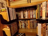 CABINET FULL OF DVDS APPROXIMATELY 100 MOSTLY JOHN WAYNE