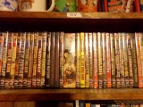 SHELF LOT FULL OF DVDS  OVER 100 WESTERNS INCLUDING RIDERS OF BLACK MOUNTAI