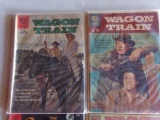 FOUR COMIC BOOKS DELL WAGON TRAIN WITH ROBERT HORTON THE CONQUEROR WITH JOH