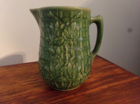 GREEN PITCHER WITH EMBOSSED ROSES APPROXIMATELY 8 1/2 INCH TALL