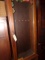 GUN CABINET 6 GUN WITH LARGE LOT OF TRI STATE SHOOTING PATCHES INCLUDING 25