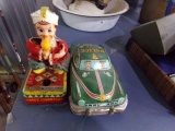 LOT OF TWO VINTAGE TOYS THE SNAKE CHARMER AND POLICE DEPT CAR MADE IN JAPAN