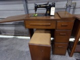 ELECTRIC SINGER SEWING MACHINE WITH TABLE AND BENCH WITH DRAWERS FULL OF SI