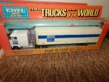 SET OF SEVEN INCLUDING SIX NEW IN BOX ERTL MINIATURES OF THE WORLD TRUCKS O