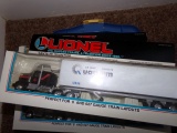 BOX LOT WITH THREE LIONEL TRAINS SANTA FE QUANTUM TRACTOR AND TRAILER LITTL