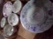 BOX OF HAND PAINTED COFFEE CUPS SAUCERS AND MORE